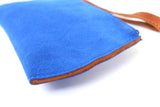 [Electric Bluebonnet Suede/Saddle Tan] Pommel Wristlet side view showing leather and suede edge.