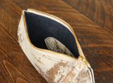 Cowhide Pommel Wristlet open view showing Dark Denim Blue suede lining.
