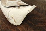 Cowhide Crossbody Saddle Bag side view features the Opal .R. Helm gold logo. Shown in color [Cowhide B].