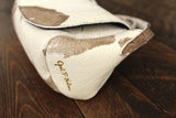 Cowhide Crossbody Saddle Bag side view features the Opal .R. Helm gold logo. Shown in color [Cowhide C].
