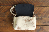 Cowhide Crossbody Saddle Bag open view features the Dark Denim Blue suede interior lining. Shown in color [Cowhide E].
