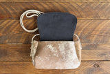 Cowhide Crossbody Saddle Bag open view features the Dark Denim Blue suede interior lining. Shown in color [Cowhide F].