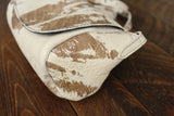 Cowhide Crossbody Saddle Bag side view features the Opal .R. Helm gold logo. Shown in color [Cowhide G].