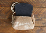 Cowhide Crossbody Saddle Bag open view features the Dark Denim Blue suede interior lining.Shown in color [Cowhide I].