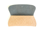 Embossed skull clutch open view showing dusty blue suede lining.