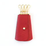 [Deep In The Heart] Vintage-inspired leather key pouch in with 4 gold key hooks and button stud closure. Fits standard-sized keys inside key pouch.